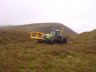  - Rab made his own style of front cradle up to carry material and tools.  Here he is working at Dalnaspidal next to the Drumochter Pass, one of the most hostile regions in Highland Scotland.  When working in remote areas like this you need reliable, high performance equipment - Rab chose the Bryce Suma Post Driver.